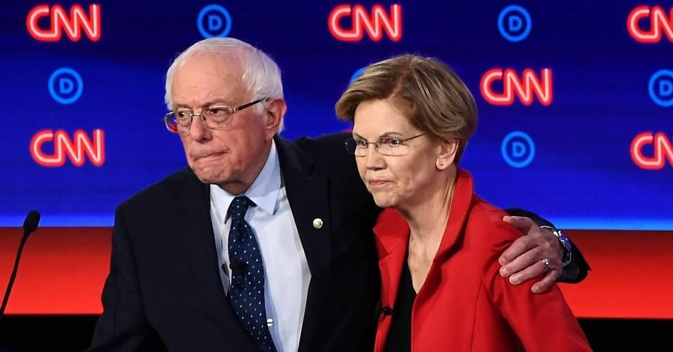 Sen. Bernie Sanders (I-Vt.) and Sen. Elizabeth Warren (D-Mass.) hug after participating in the first round of the second Democratic primary debate of the 2020 presidential campaign season in Detroit, Michigan.