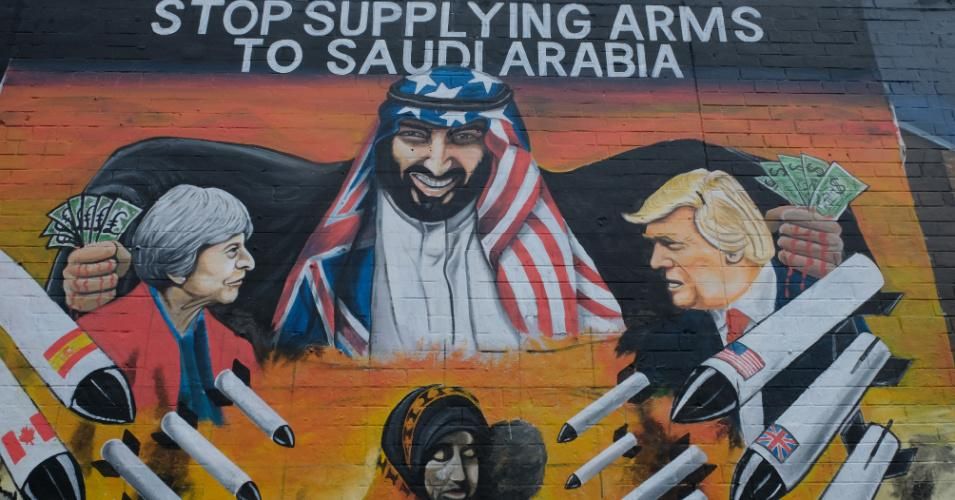Street art in Belfast depicts Saudi Arabia's Prince Ben Salman buying missiles, which are used against Yemeni civilians, from U.S. President Donald Trump and former U.K. Prime Minister Theresa May. (Photo: Kaveh Kazemi/Getty Images)