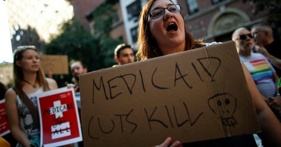 A small group of activists rally against the Republican healthcare agenda outside of the Metropolitan Republican Club, July 5, 2017 in New York City