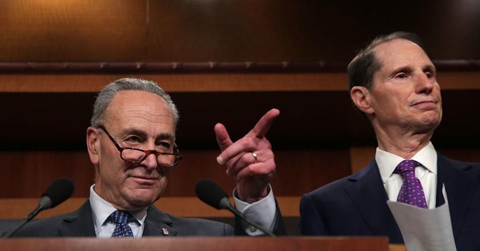 Sens. Chuck Schumer (L) and Ron Wyden sent a letter to Treasury Department inspectors general on Thursday urging them to probe possible political interference in IRS audits of President Donald Trump's tax returns. (Photo: Alex Wong/Getty Images) 