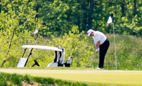 President Trump plays golf in Sterling, Va., on May 23. (Photo: Jim Lo Scalzo/EPA-EFE/REX/Shutterstock)