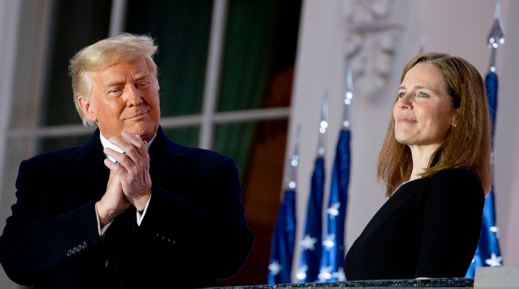 U.S. President Donald Trump stands with newly sworn-in U.S. Supreme Court Justice Amy Coney Barrett during a ceremonial swearing-in event on the South Lawn of the White House on October 26, 2020. (Photo: Tasos Katopodis/Getty Images)