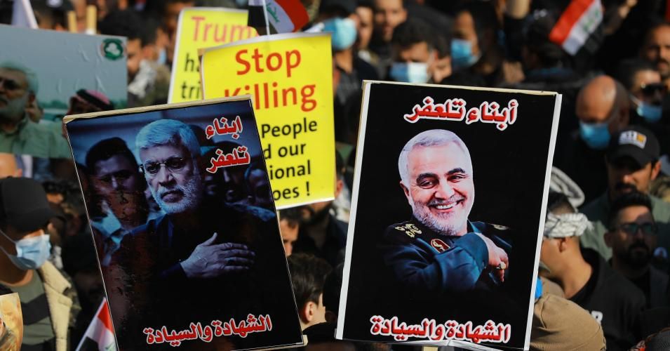 Iraqis take part in a protest at Tahrir Square to commemorate the one-year anniversary of the U.S. assassination of Iranian military commander Gen. Qasem Soleimani on January 3, 2021.