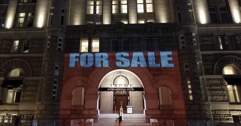 Advocacy group Tax March projects "For Sale" onto the Trump Hotel in Washington, D.C. on October 26, 2019. 
