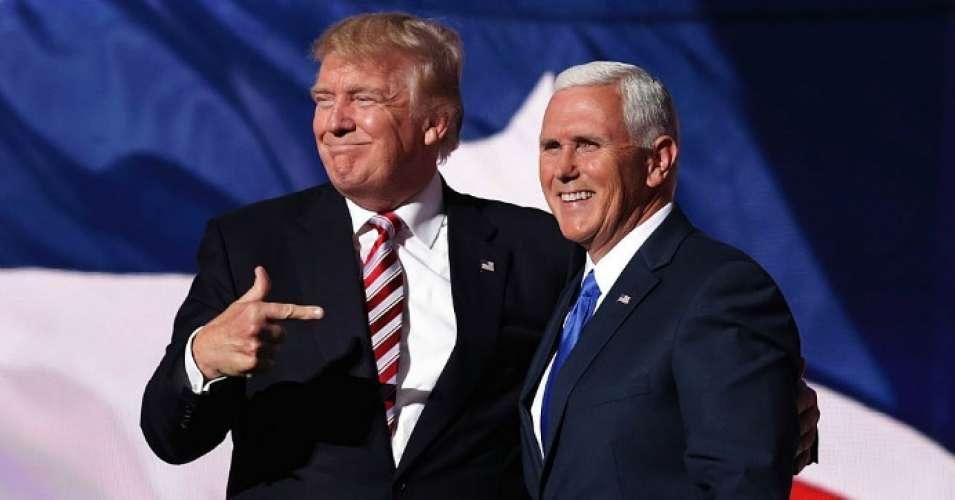 Then-Republican presidential candidate Donald Trump stands with Republican vice presidential candidate Mike Pence and acknowledge the crowd on the third day of the Republican National Convention on July 20, 2016 at the Quicken Loans Arena in Cleveland, Ohio.