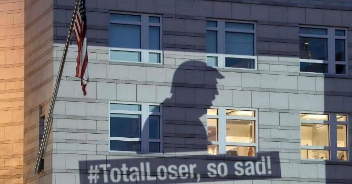 Greenpeace activists in Berlin, Germany responded to news of the U.S. withdrawal from the Paris climate agreement by projecting an image of President Donald Trump on the U.S. Embassy on Thursday. (Photo: Michael Sohn/DPA)
