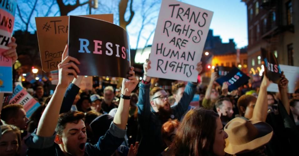 People take part in rally outside the Stonewall Inn, a landmark of the gay rights movement, on February 23, 2017 in the Greenwich Village area of New York City, demanding equal rights for transgender and gender non-conforming people.