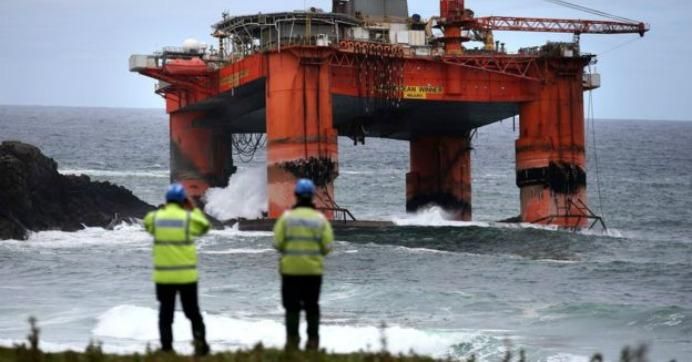 A Transocean drilling rig was blown ashore and is now leaking oil along the coast of Scotland's Isle of Lewis. (Photo: PA)