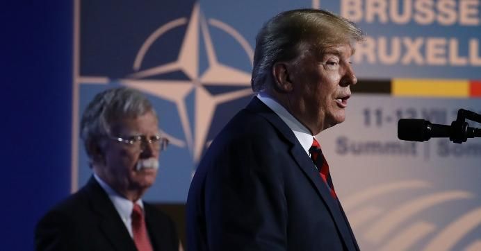 U.S. President Donald Trump, flanked by hawkish National Security Advisor John Bolton