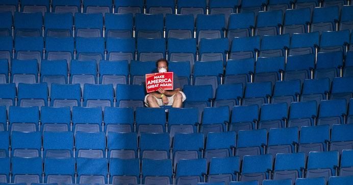 A supporter sits alone in the top sections of seating as Vice President Mike Pence speaks before President Donald J. Trump arrives for a "Make America Great Again!" rally at the BOK Center on Saturday, June 20, 2020 in Tulsa, Oklahoma. 