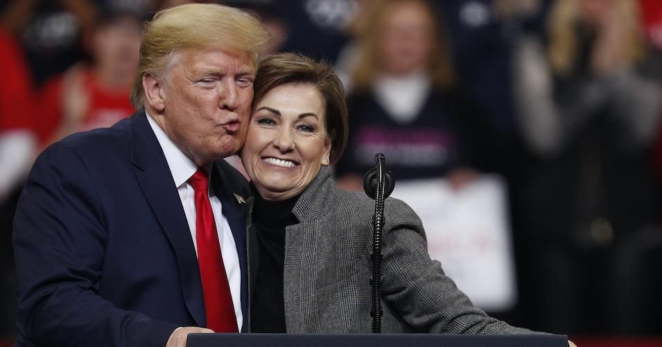 Iowa Governor Kim Reynolds, pictured at a rally with President Donald Trump in January, told Iowans that if they do not return to work when asked they will lose unemployment benefits.