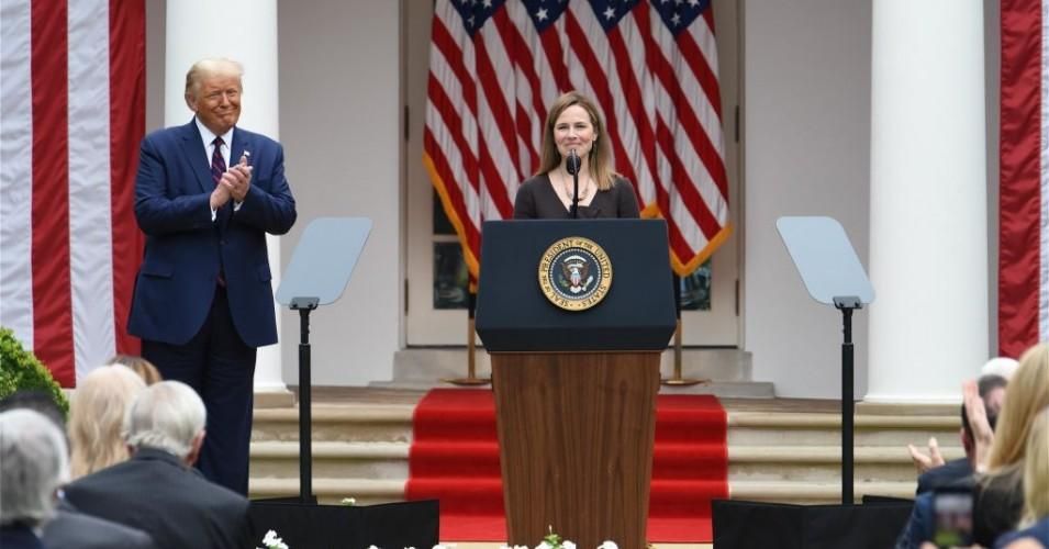 Amy Coney Barrett speaks as President Donald Trump listens during an announcement ceremony at the White House on September 26, 2020 in Washington, D.C.