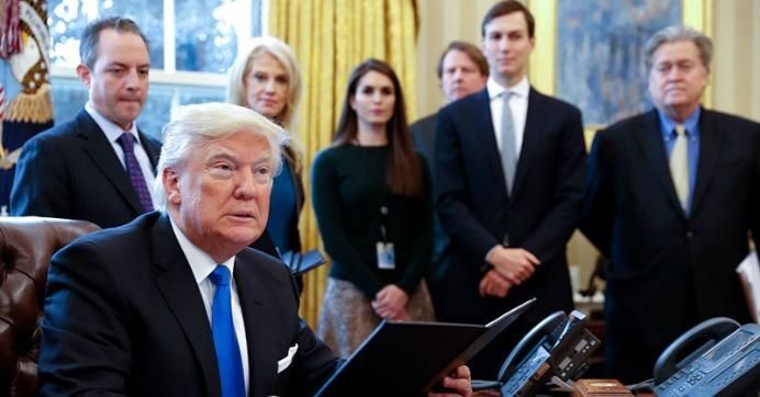 President Donald Trump in January 2017 surrounded by members of his senior staff, including White House chief of staff Reince Priebus, counselor to the President Kellyanne Conway, and Senior Counselor Stephen Bannon. (Photo: Shawn Thew-Pool/Getty Images)
