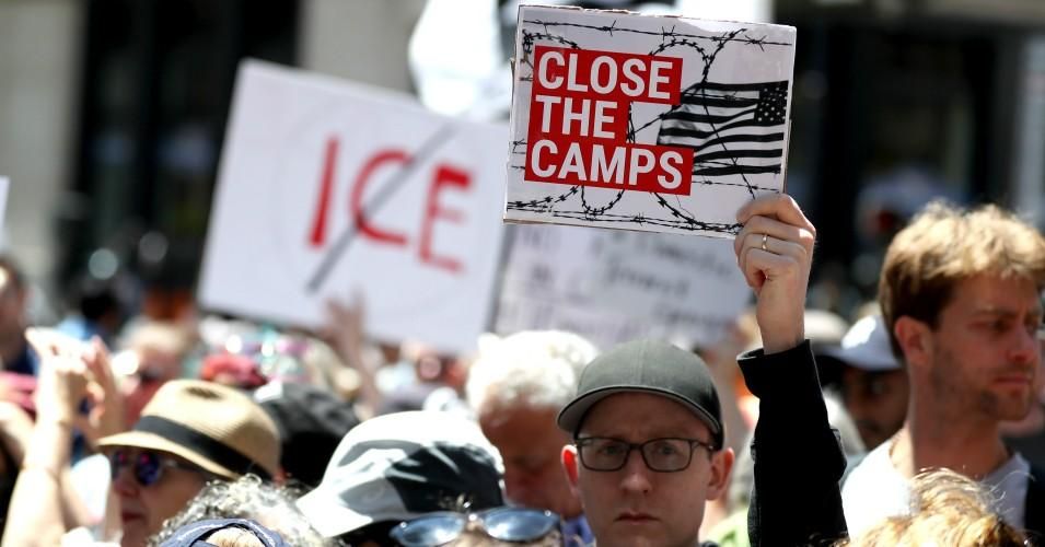 Protesters hold signs during a demonstration against migrant detention facilities on July 2, 2019 in San Francisco, California. (Photo: Justin Sullivan/Getty Images)