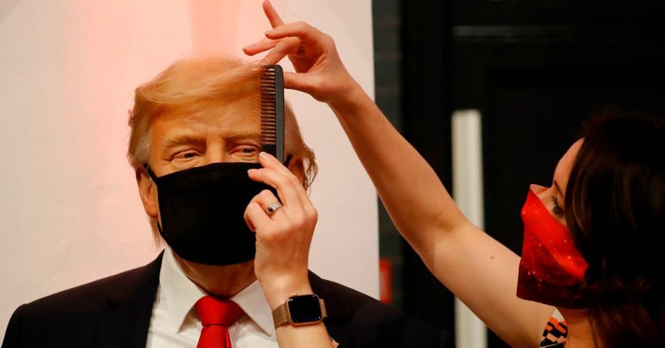 An artist puts the finishing touches to a wax figure of US President Donald Trump as Madame Tussauds prepares to reopen its doors to the public on July 30, 2020 following the easing of coronavirus lockdown restrictions in England. (Photo: Tolga Akmen AFP) 