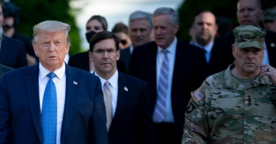 President Donald Trump walks with Secretary of Defense Mark Esper, Chairman of the Joint Chiefs of Staff Mark Milley, and others from the White House to visit St. John's Church on June 1, 2020, in Washington, D.C. (Photo: Brendan Smialowski/AFP via Getty Images)