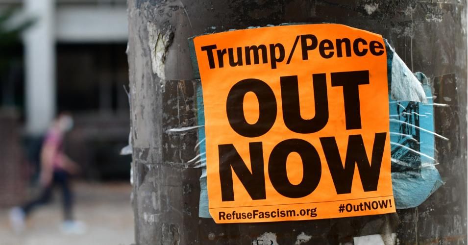 A tattered sticker seen on November 10, 2020 in Philadelphia, Pennsylvania reads "Trump/Pence OUT NOW." (Photo: Mark Makela/Getty Images)