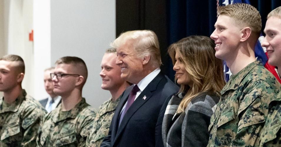 President Donald J. Trump alongside First Lady Melania Trump and members of the U.S. military in this file image posted to a government website to commemorate Veterans Day. (Photo: WhiteHouse.gov)