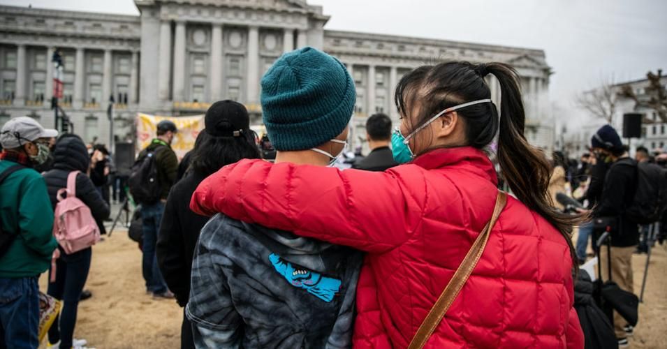 People embrace during a "Love Our People, Heal Our Communities" rally in San Francisco on February 14, 2021. (Photo: Stephen Lam/San Francisco Chronicle via Getty Images) 