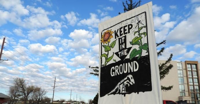 Sign reads: Keep it in the ground