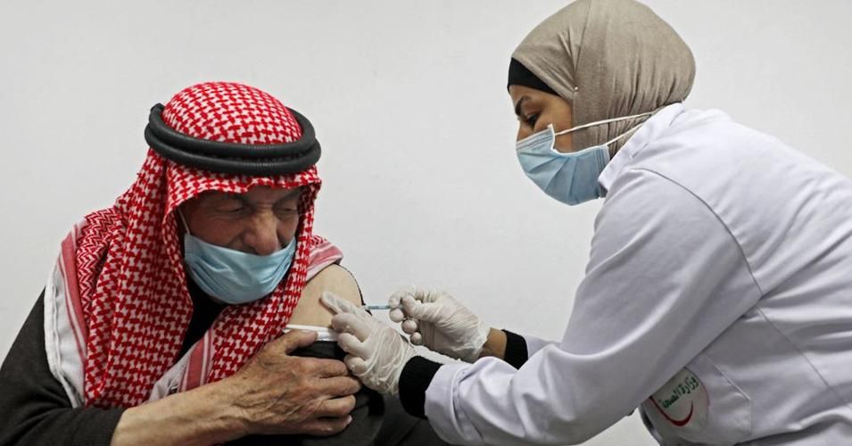 An elderly Palestinian man is injected with Covid-19 vaccine in Hebron on March 22, 2021. (Photo: Jaafar Ashtiyeh/AFP via Getty Images)