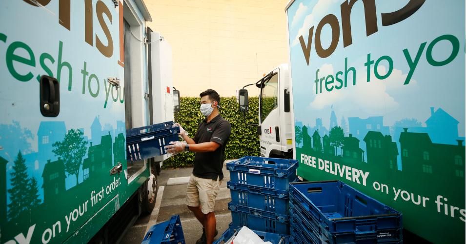 James Hang, a driver for Vons home delivery, loads grocery orders onto his truck in Torrance, CA on April 27, 2020. (Photo: Al Seib/Los Angeles Times via Getty Images)