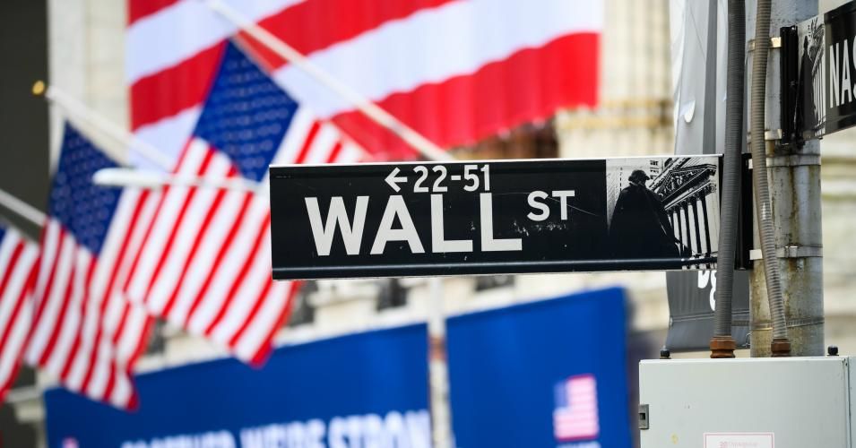 A view of the Wall Street street sign with the New York Stock Exchange during the coronavirus pandemic on May 25, 2020 in New York City. (Photo: Noam Galai/Getty Images)