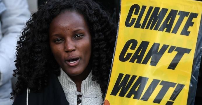 Fridays for Future striker Vanessa Nakate of Uganda holds a placard reading "climate can't wait" during a protest on climate emergency, called by environmental groups including Extinction Rebellion and Fridays For Future, outside the U.N. Climate Change Conference COP25 at the 'IFEMA - Feria de Madrid' exhibition centre, in Madrid, on December 13, 2019.