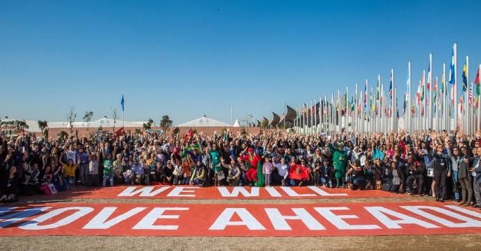 Attendees of the United Nations climate conference in Marrakech, Morocco surround the words: "We Will Move Ahead." (Photo: Greenpeace)