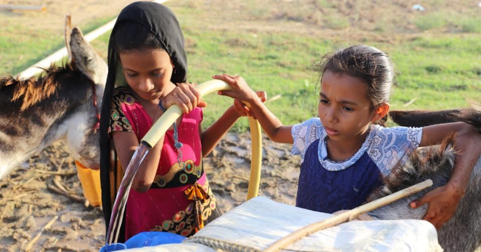 Girls collect water from a well in Hajjah province, north Yemen on December 11, 2020. As a result of the U.S. State Department's decision, Oxfam noted, "humanitarian aid, goods, and personnel will be blocked from entering northern Yemen, where 70% of the population lives." (Photo: Mohammed Al-Wafi/Xinhua via Getty)