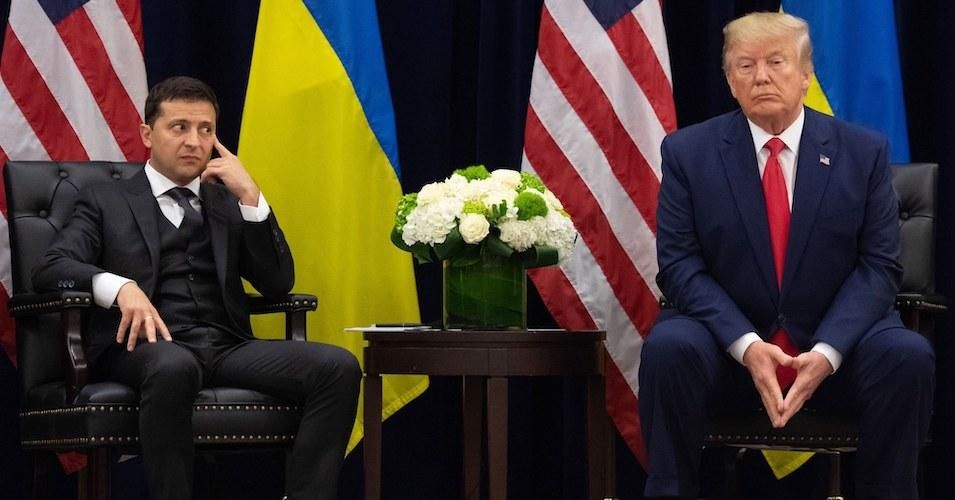 Ukrainian President Volodymyr Zelensky looks on as U.S. President Donald Trump answers questions about the duo's July phone call. 