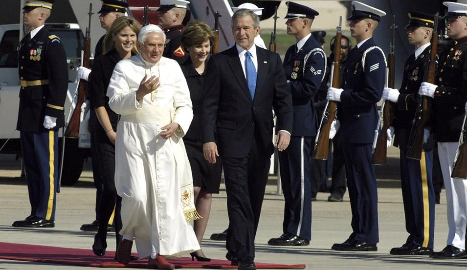 Pope Benedict XVI talks to President George W. Bush upon his arrival as he is escorted by a joint honor guard April 15 at Andrews Air Force Base, Md. The pope is visiting the United States for a week and will meet with President Bush at the White House, address the presidents of Roman Catholic colleges and universities, and celebrate Mass at Nationals Park in Washington, D.C., and Yankee Stadium in New York City. The pontiff was selected as the 265th pope on April 19, 2005. (U.S. Air Force photo/Senior Airm