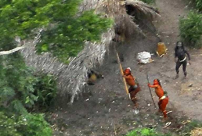This uncontacted indigenous group in the Brazilian Amazon is clearly hostile to the helicopter hovering overhead. Photo credit: TravelingMan on VisualHunt / CC BY-NC-ND.