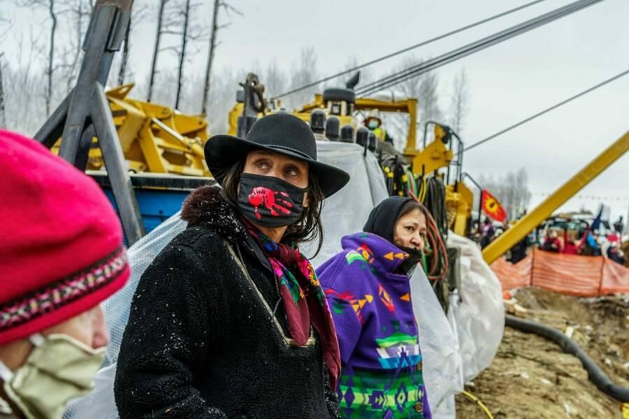 Anishinaabe activist Winona LaDuke (center) stands with other water protectors against construction of the Line 3 pipeline in Minnesota on Jan. 9. (Photo: KEREM YUCEK/AFP VIA GETTY IMAGES)
