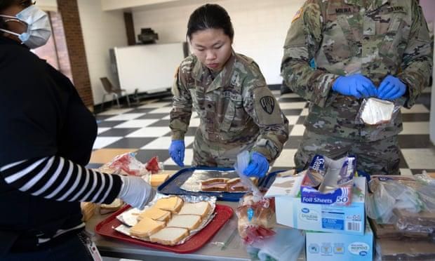 National guard troops put together sandwiches for coronavirus-affected residents in New Rochelle, New York. (Photo: John Moore/Getty Images)