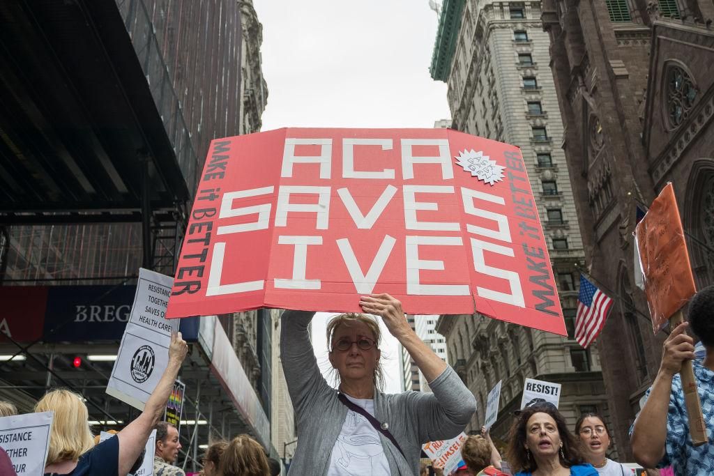 Participants hold signs while protesting the repeal and replacement of the Affordable Care Act in 2017. (Pre-COVID) (Photo by Albin Lohr-Jones/Pacific Press/LightRocket via Getty Images)