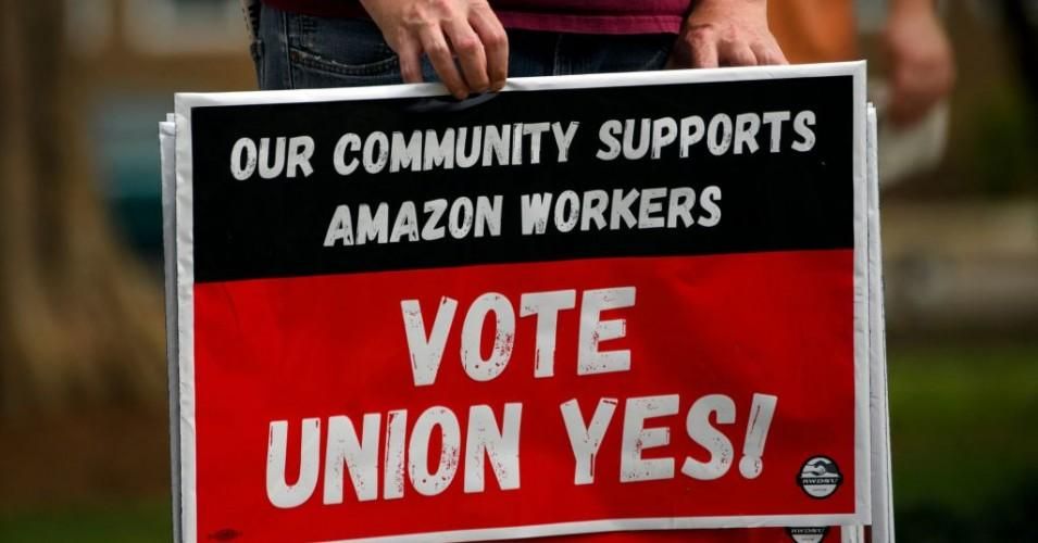 A person holds "Vote Union Yes!" signs during a protest in solidarity with Black Lives Matter, Stop Asian Hate and the unionization of Amazon.com, Inc. fulfillment center workers at Kelly Ingram Park on March 27, 2021 in Birmingham, Alabama. (Photo: Patrick T. Fallon/AFP via Getty Images)