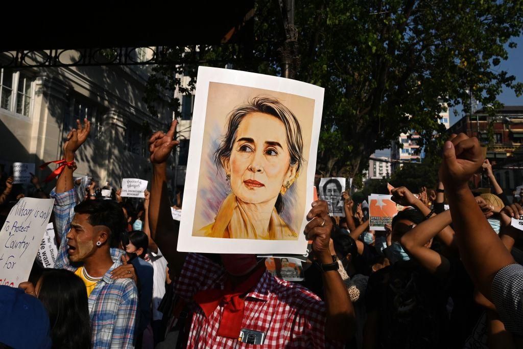 A protester holds a portrait of Aung San Suu Kyi during a demonstration against the military coup in Yangon on February 8, 2021. (Photo by STR / AFP) (Photo by STR/AFP via Getty Images)