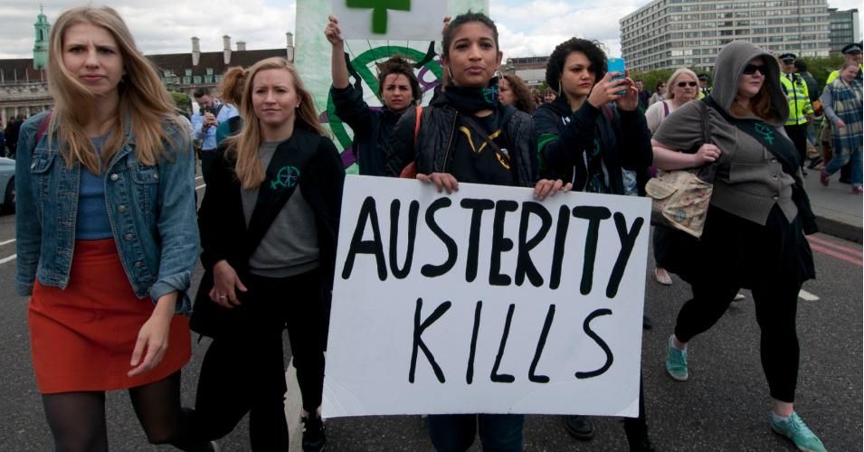 Activists march at a protest against austerity organized by U.K. Uncut on May 30, 2015. (Photo: In Pictu