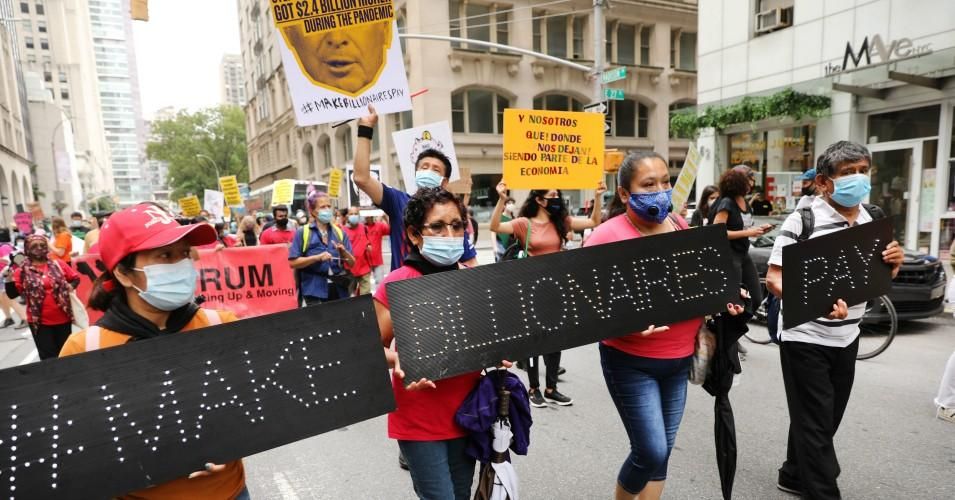 People participate in a "March on Billionaires" event on July 17, 2020 in New York City. 