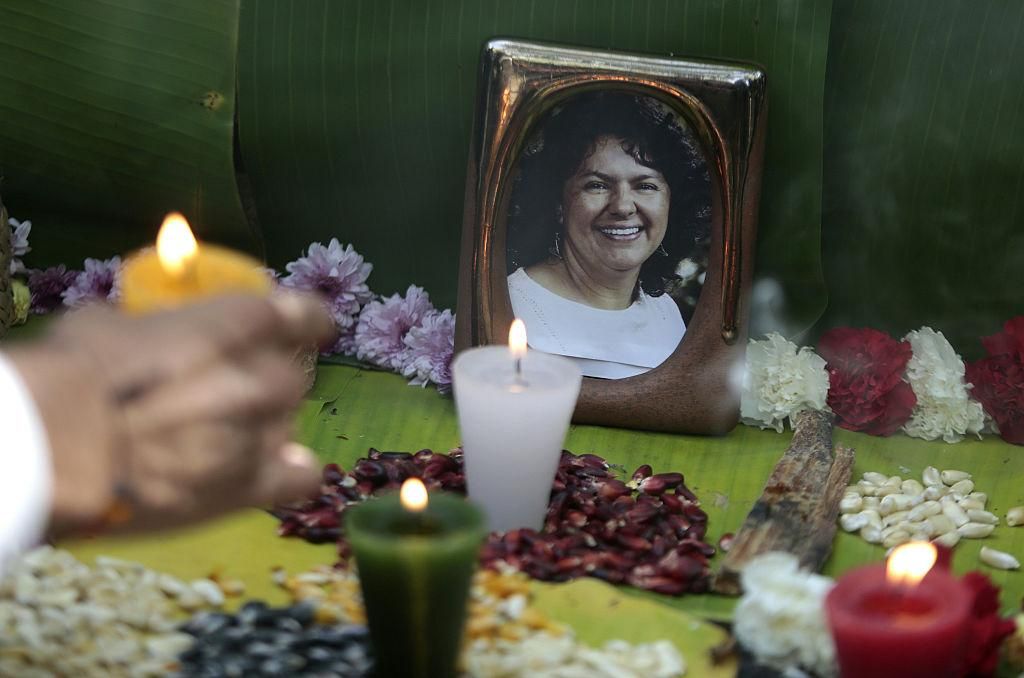 An activist places a candle in a offering to murdered Honduran indigenous environmentalist Berta Caceres during a demonstration outside the Honduran embassy in Mexico City on June 15, 2016. (Photo: PEDRO PARDO/AFP via Getty Images)