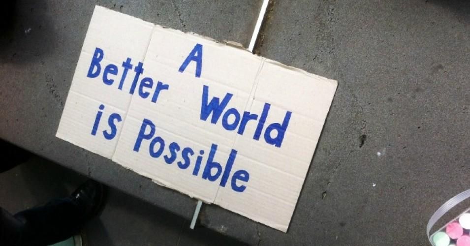 A better world is possible, reads a sign