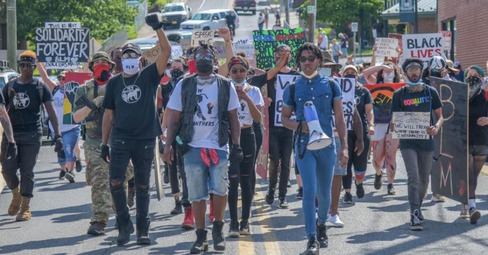 Travon Brown, with megaphone, leads the Black Lives Matter Protest march through Marion, Virginia on Friday, July 3, 2020