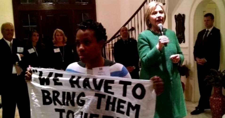 Ashley Williams interrupted Hillary Clinton at a private event by unfurling a banner with the phrase "we have to bring them to heel" – a reference to comments she made in the 1990s while supporting a criminal reform bill pushed by her husband President Bill Clinton.