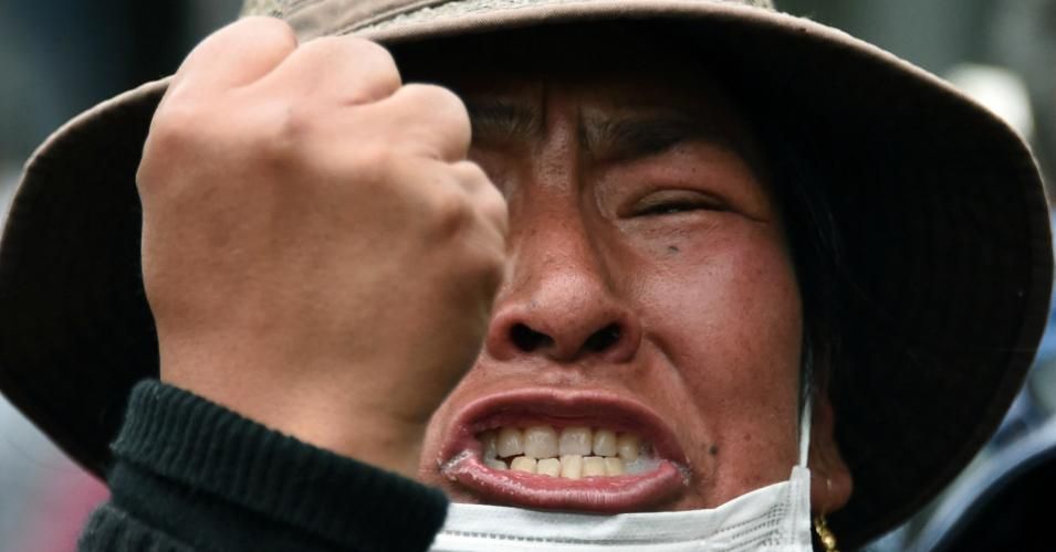 Supporters of Bolivian ex-President Evo Morales, take part in a march in downtown La Paz on November 12, 2019, after he left in exile to Mexico. - Bolivia's Evo Morales was en route to exile in Mexico on Tuesday, leaving behind a country in turmoil after his abrupt resignation as president. The senator set to succeed Morales as interim president, Jeanine Anez, pledged to call fresh elections to end the political crisis. (Photo: Aizar Raldes/AFP via Getty Images)