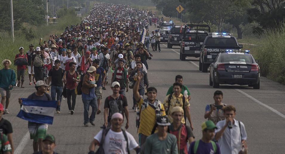 The caravan of thousands of Central Americans advance walking after the federal police opened the road to Tapanatepec on October 27, 2018 in Tapanatepec, Mexico. The caravan of the Central Americans plans to eventually reach the United States.