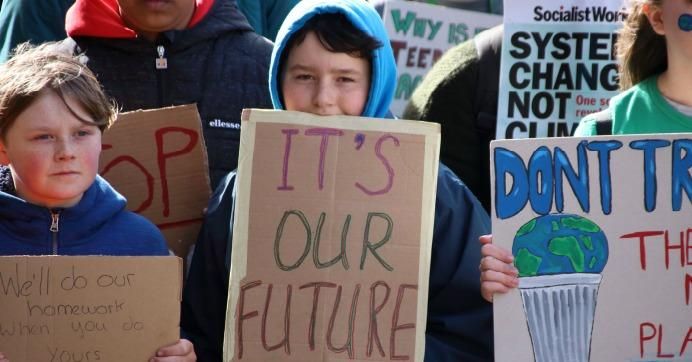  Young people take part in the March 15, 2019 global youth strike for climate justice in Nottingham, England.