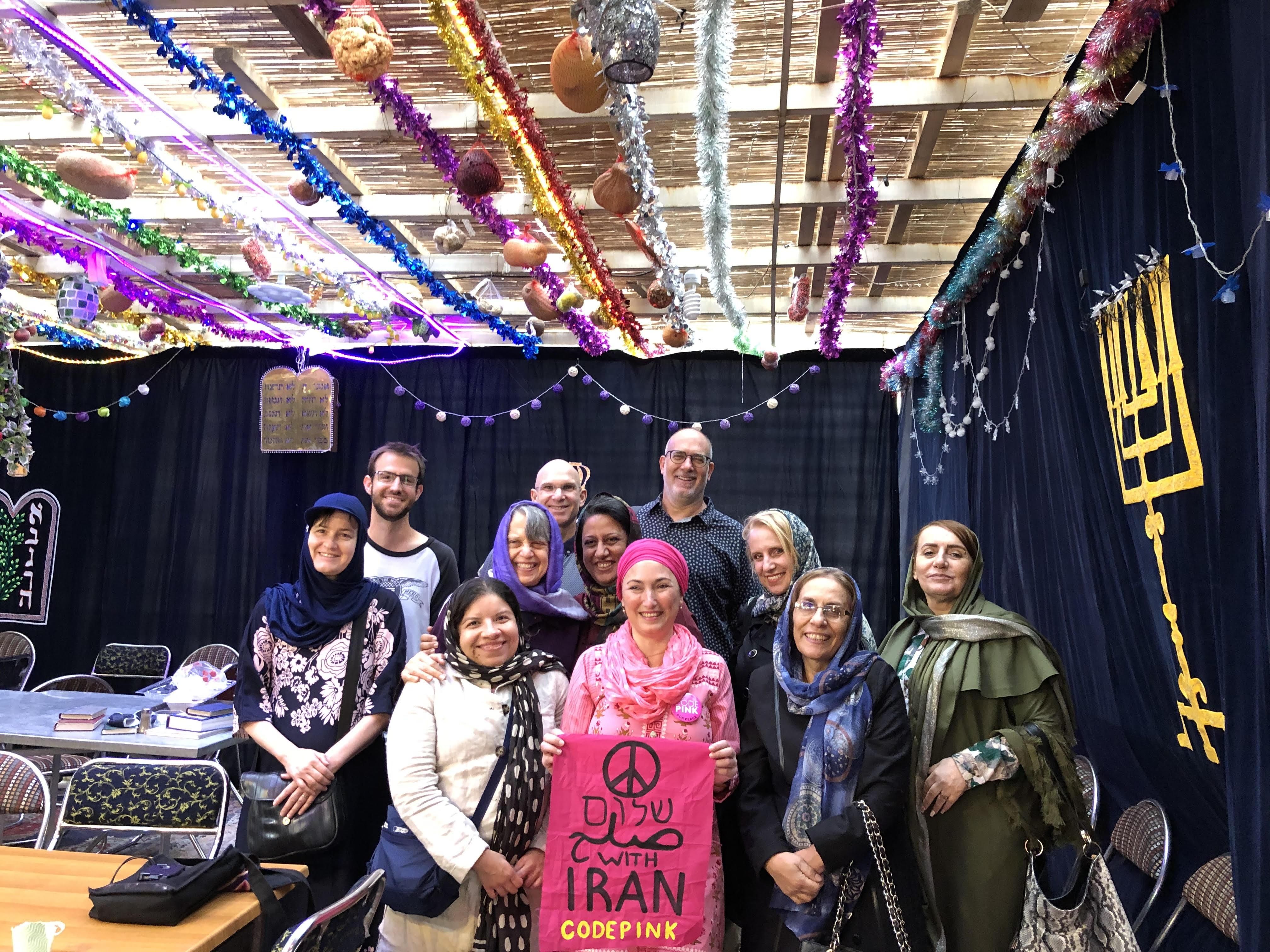 CODEPINK delegation in the sukkot of the Yusef Abad synagogue. (Photo: CODEPINK)