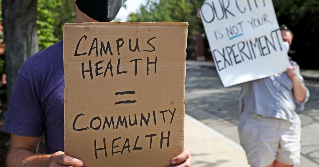 Residents of the Somerville and Medford communities protest outside of Tufts University President Anthony Monaco's house in Medford, MA on Aug. 18, 2020. (Photo: David L. Ryan/The Boston Globe via Getty Images)