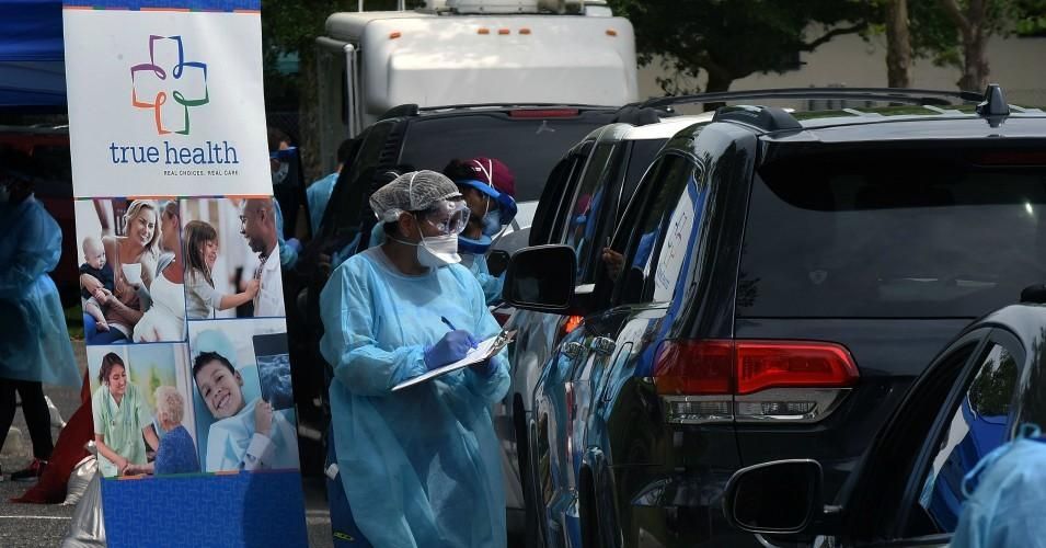 Health workers greet people as they arrive in cars at a mobile Covid-19 testing site at the Westside Community Center in the Goldsboro neighborhood of Sanford, Florida on April 23, 2020. (Photo: Paul Hennessy/NurPhoto via Getty Images)